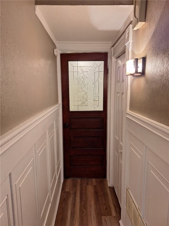 545 Roseland Ave, Ross Twp, PA 15214 - doorway featuring a decorative wall, dark wood-type flooring, and a wainscoted wall