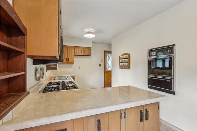 137 Terry Ln, Center Twp Bea, PA 15061 - kitchen with black oven, gas stovetop, light countertops, a peninsula, and a warming drawer