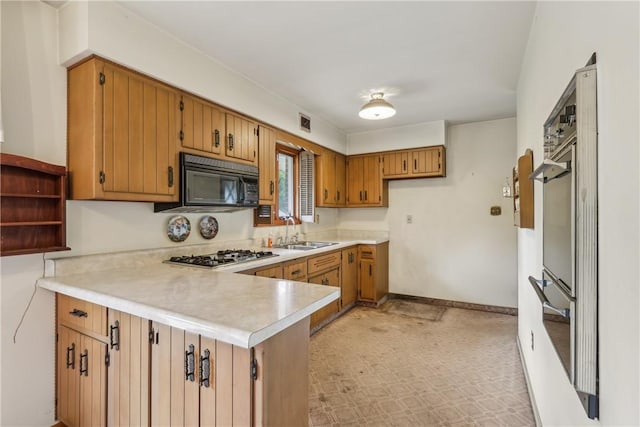 137 Terry Ln, Center Twp Bea, PA 15061 - kitchen featuring black microwave, stainless steel gas cooktop, a peninsula, a sink, and light countertops