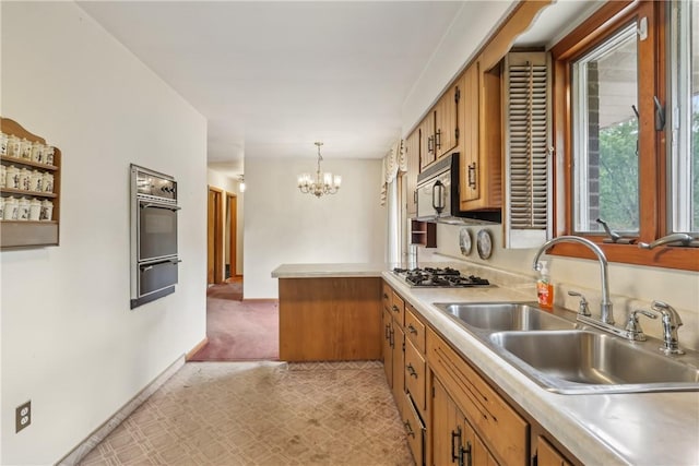 137 Terry Ln, Center Twp Bea, PA 15061 - kitchen featuring stainless steel appliances, a sink, a warming drawer, and brown cabinetry