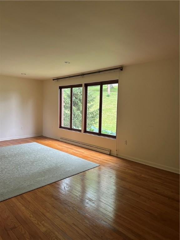 141 Mar Vel Dr, Center Twp But, PA 16001 - spare room featuring a baseboard heating unit, baseboards, and light wood finished floors