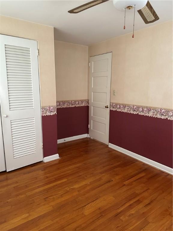 141 Mar Vel Dr, Center Twp But, PA 16001 - empty room with a ceiling fan, wood finished floors, wainscoting, and baseboards
