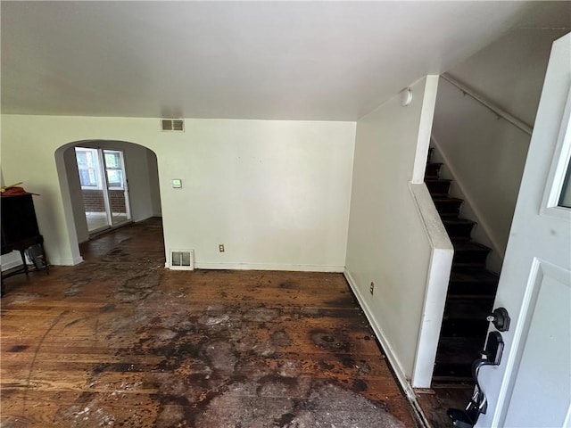 2905 Blackridge Ave, Penn Hills, PA 15235 - unfurnished living room with arched walkways, stairs, and baseboards
