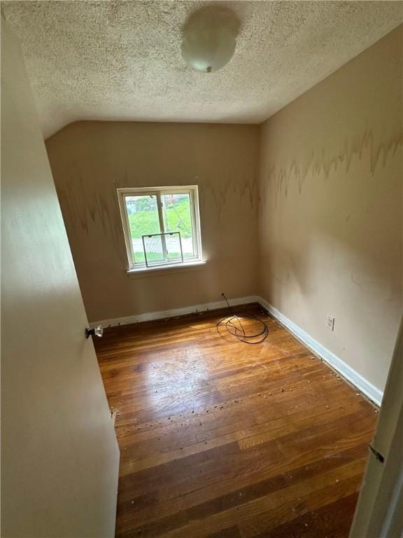 2905 Blackridge Ave, Penn Hills, PA 15235 - empty room featuring a textured ceiling, wood finished floors, and baseboards