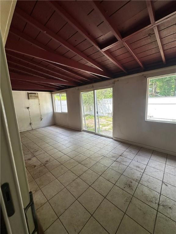 2905 Blackridge Ave, Penn Hills, PA 15235 - spare room with wooden ceiling with exposed beams and light tile patterned flooring