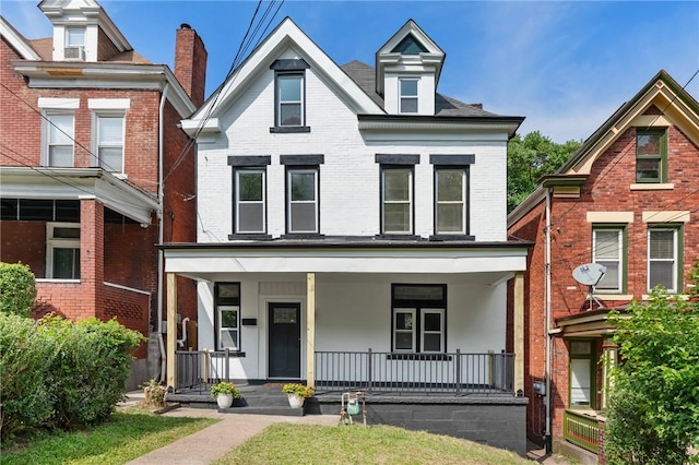 5415 Black St, East Liberty, PA 15206 - view of front of house featuring brick siding and covered porch