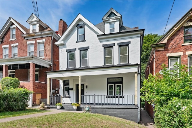5415 Black St, East Liberty, PA 15206 - view of front facade with brick siding and covered porch