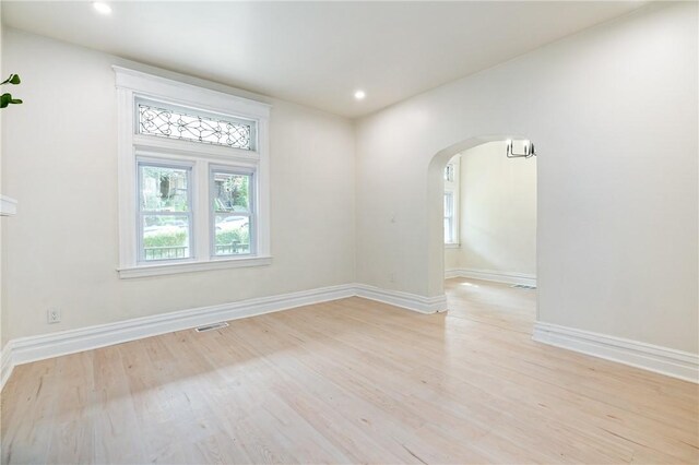 5415 Black St, East Liberty, PA 15206 - spare room featuring arched walkways, light wood-style floors, baseboards, and recessed lighting