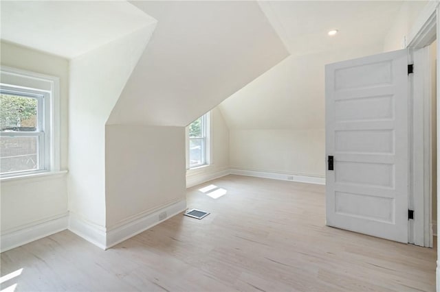 5415 Black St, East Liberty, PA 15206 - additional living space featuring vaulted ceiling, baseboards, and wood finished floors