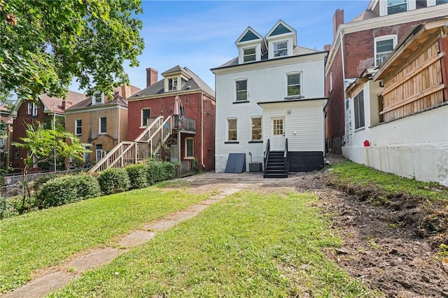 5415 Black St, East Liberty, PA 15206 - back of property with a yard and cooling unit