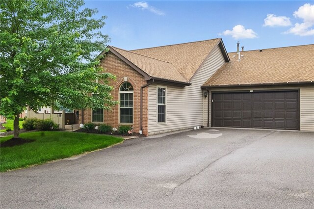 146 Barrington Dr, Collier Twp, PA 15071 - view of front of home featuring driveway, brick siding, an attached garage, roof with shingles, and a front lawn