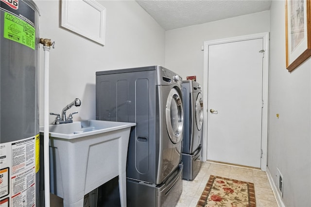 146 Barrington Dr, Collier Twp, PA 15071 - laundry room with gas water heater, independent washer and dryer, and a textured ceiling