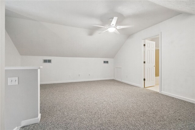 146 Barrington Dr, Collier Twp, PA 15071 - additional living space with vaulted ceiling, a ceiling fan, baseboards, and carpet floors