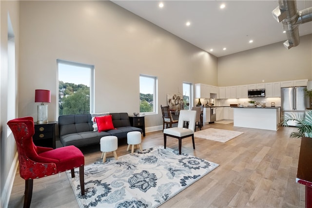 3809 Liberty Ave Unit 403, Lawrenceville, PA 15201 - living area with a towering ceiling, light wood-type flooring, and recessed lighting