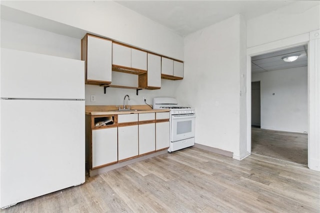 3318 Juliet St, Oakland, PA 15213 - kitchen with white appliances, a sink, light wood finished floors, white cabinets, and light countertops