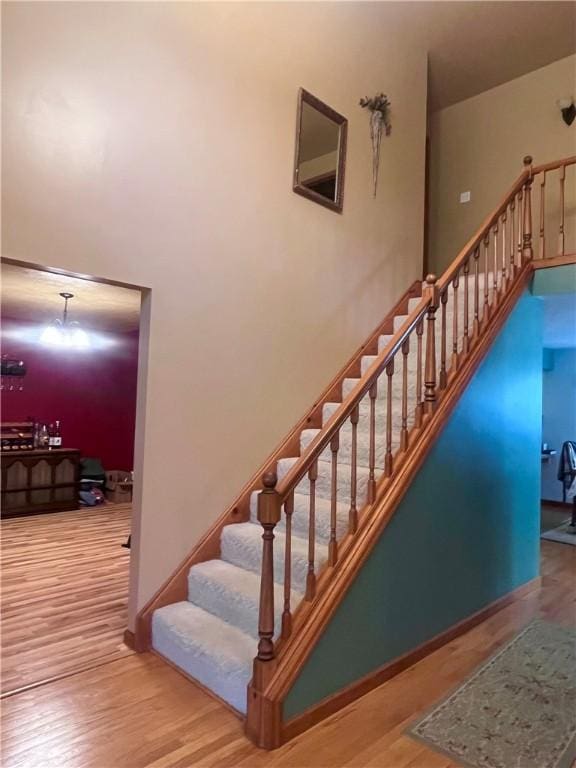 101 Pheasant Run Dr, Worth Twp But, PA 16057 - staircase featuring a high ceiling and wood finished floors