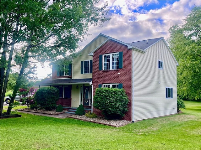 101 Pheasant Run Dr, Worth Twp But, PA 16057 - traditional-style home with covered porch, a front lawn, and brick siding