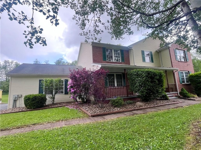 101 Pheasant Run Dr, Worth Twp But, PA 16057 - traditional home with a porch, a front lawn, and brick siding