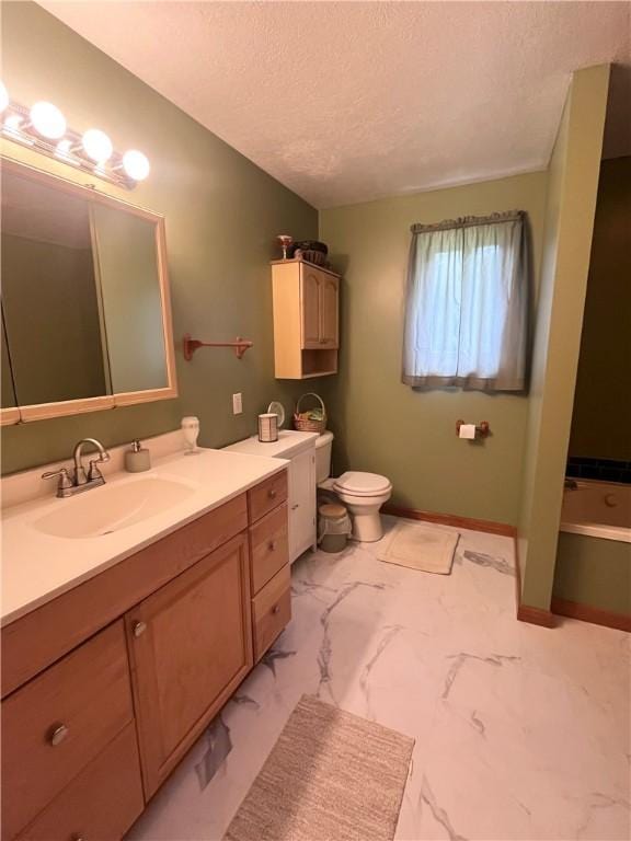 101 Pheasant Run Dr, Worth Twp But, PA 16057 - full bathroom with a textured ceiling, vanity, a tub to relax in, toilet, and marble finish floors