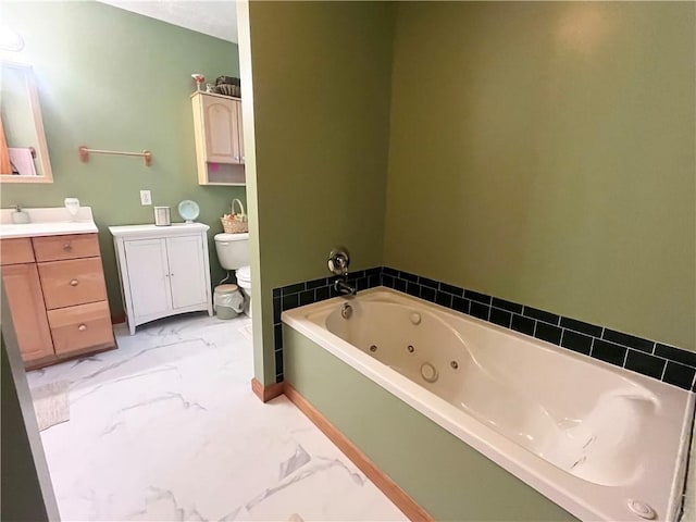 101 Pheasant Run Dr, Worth Twp But, PA 16057 - bathroom with vanity, toilet, marble finish floors, and a jetted tub