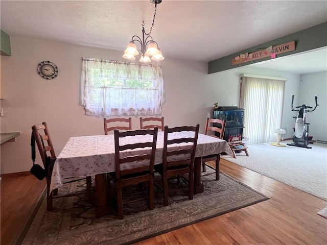 101 Pheasant Run Dr, Worth Twp But, PA 16057 - dining room featuring a chandelier and wood finished floors