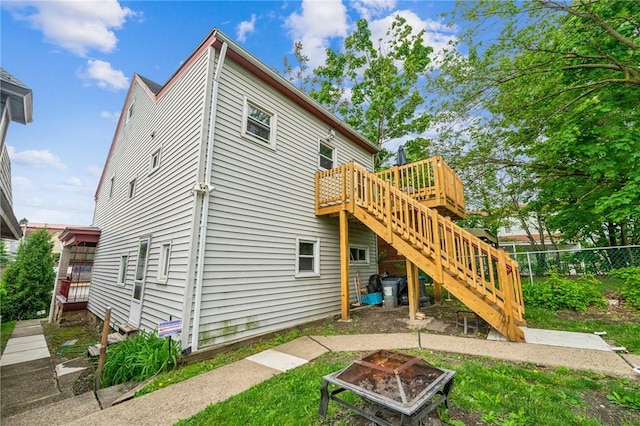 1725 Arlington Ave, South Side, PA 15210 - rear view of house featuring a fire pit, stairs, and a deck