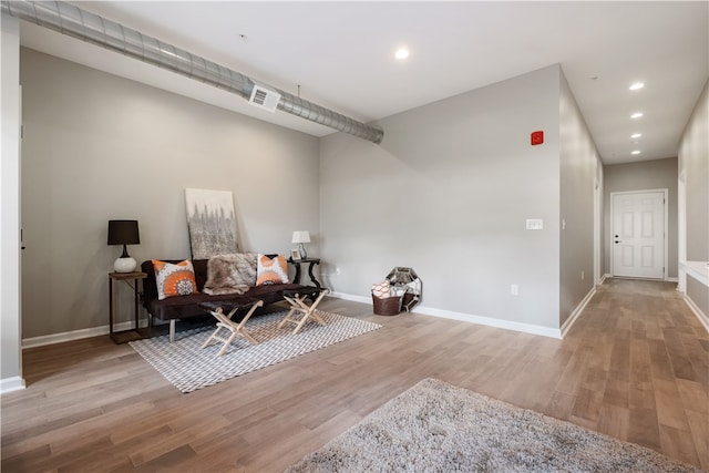 3809 Liberty Ave Unit 302, Lawrenceville, PA 15201 - sitting room featuring wood finished floors, baseboards, and recessed lighting