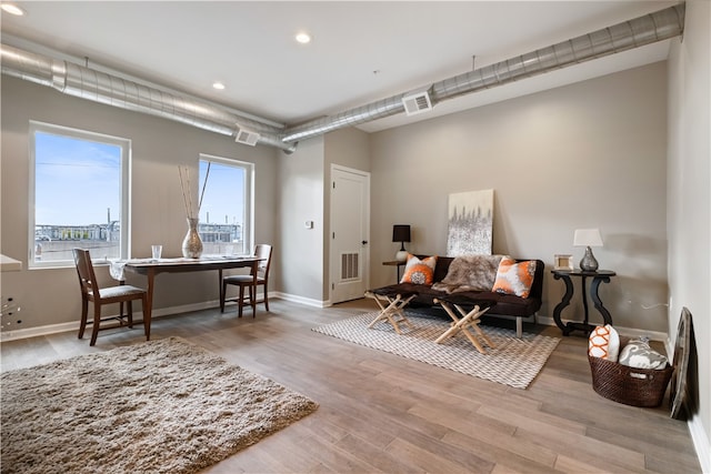 3809 Liberty Ave Unit 302, Lawrenceville, PA 15201 - living room with recessed lighting, wood finished floors, and baseboards