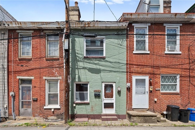 410 Orwell Way, Bloomfield, PA 15224 - townhome / multi-family property with a chimney and brick siding