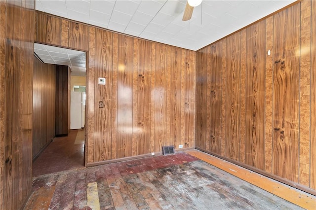 410 Orwell Way, Bloomfield, PA 15224 - spare room with ceiling fan, wooden walls, and hardwood / wood-style floors