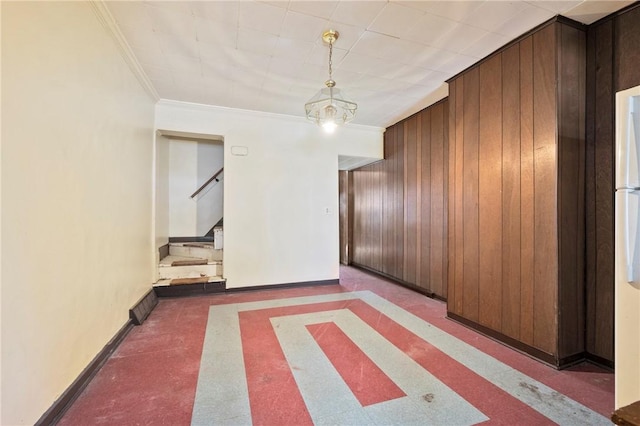 410 Orwell Way, Bloomfield, PA 15224 - unfurnished dining area featuring stairway, wood walls, inlaid floor details, baseboards, and crown molding