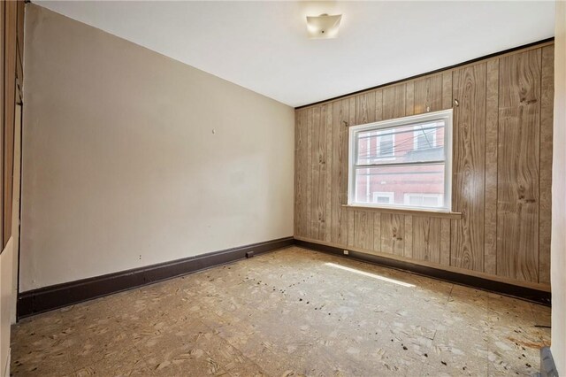410 Orwell Way, Bloomfield, PA 15224 - spare room featuring baseboards and wood walls