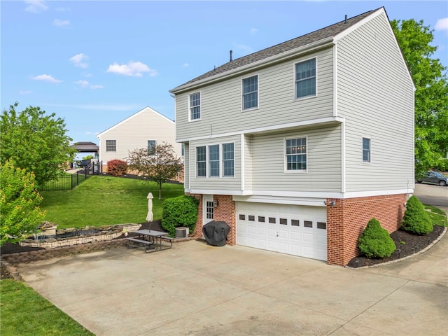 8 Trotwood Cir, North Strabane, PA 15317 - view of front of home featuring brick siding, driveway, a garage, and central AC