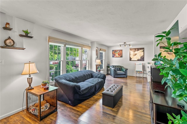 8 Trotwood Cir, North Strabane, PA 15317 - living area featuring hardwood / wood-style floors, a textured ceiling, and baseboards