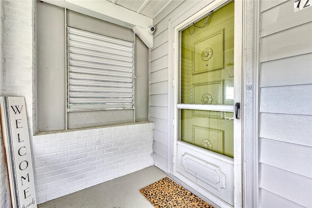 doorway to property with a surveillance system