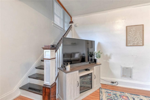 staircase with wood finished floors