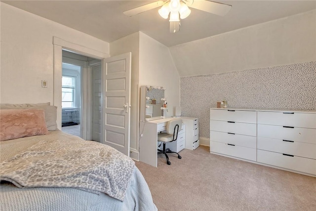 bedroom featuring light colored carpet, ceiling fan, and vaulted ceiling