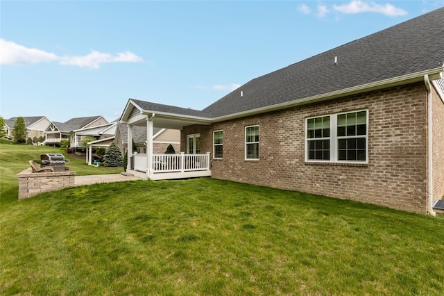 218 St Andrews, North Strabane, PA 15317 - rear view of property featuring brick siding, a lawn, and roof with shingles