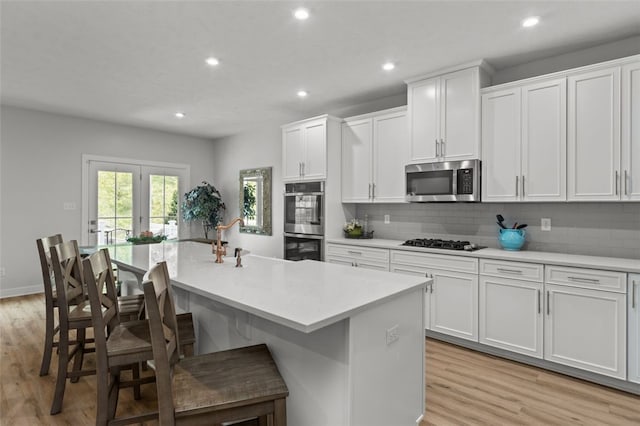 218 St Andrews, North Strabane, PA 15317 - kitchen featuring appliances with stainless steel finishes, a sink, light wood-style floors, backsplash, and recessed lighting
