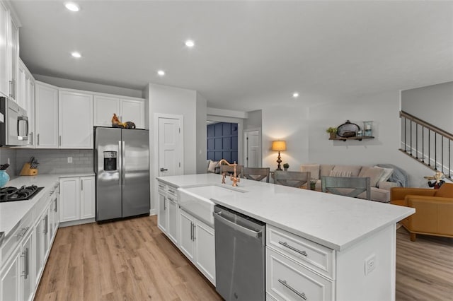 218 St Andrews, North Strabane, PA 15317 - kitchen featuring stainless steel appliances, open floor plan, white cabinetry, light wood-style floors, and recessed lighting