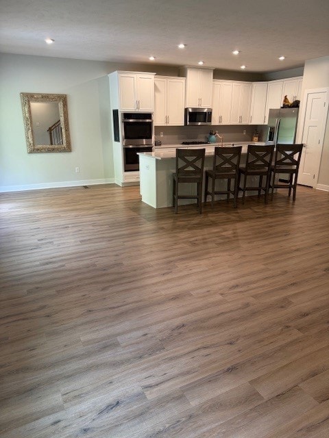 218 St Andrews, North Strabane, PA 15317 - kitchen featuring stainless steel appliances, white cabinetry, a kitchen breakfast bar, recessed lighting, and baseboards