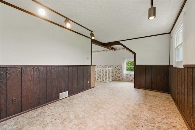 2703 Conway Wallrose Rd, Economy, PA 15005 - empty room with wainscoting, wood walls, carpet flooring, and track lighting