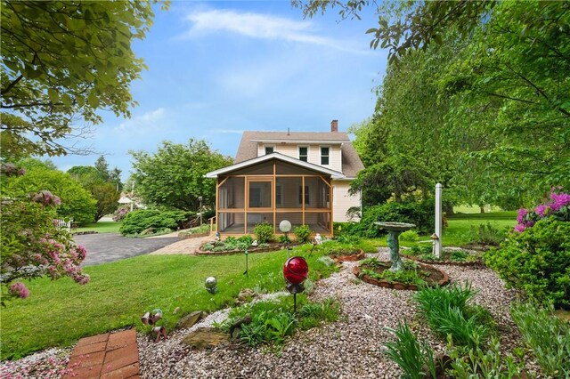 2703 Conway Wallrose Rd, Economy, PA 15005 - back of house with a sunroom, a chimney, and a yard