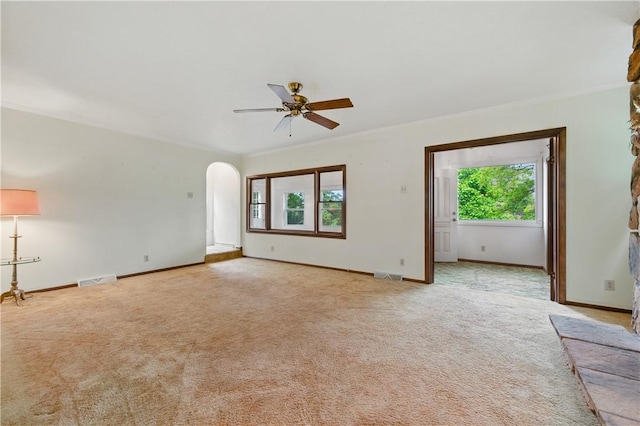 2703 Conway Wallrose Rd, Economy, PA 15005 - unfurnished room featuring healthy amount of natural light, arched walkways, a ceiling fan, light carpet, and crown molding