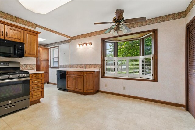 2703 Conway Wallrose Rd, Economy, PA 15005 - kitchen featuring black appliances, brown cabinets, light countertops, baseboards, and a ceiling fan