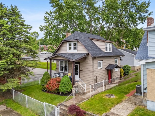 258 Wayne St, Baden, PA 15005 - bungalow-style home featuring a chimney, a shingled roof, central AC unit, and covered porch