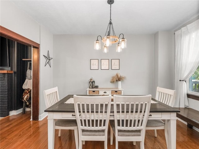 258 Wayne St, Baden, PA 15005 - dining space with wood finished floors, a chandelier, and baseboards