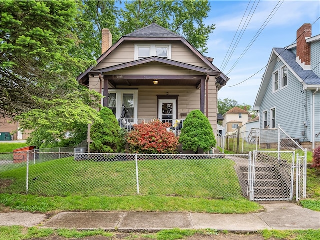 258 Wayne St, Baden, PA 15005 - shotgun-style home featuring a porch, a chimney, and a gate
