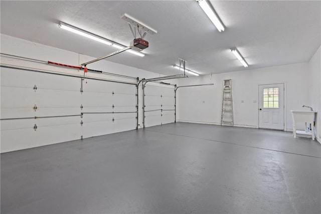 449 Bateman Rd, North Fayette, PA 15071 - garage featuring a garage door opener and a sink