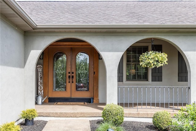 449 Bateman Rd, North Fayette, PA 15071 - property entrance with french doors, a shingled roof, a porch, and stucco siding